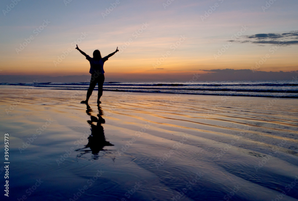 silhouette of a woman raising her two hands silhouette of a woman raising her two hands
