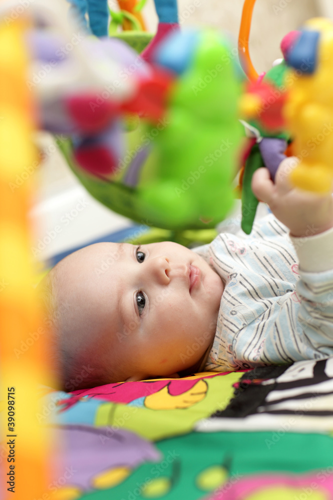 Obraz premium Baby on playing mat