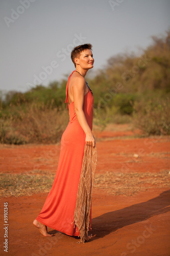 Beautiful girl dressed terracotta dress