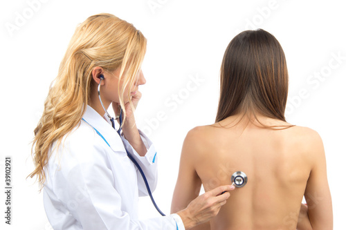 Canvas Print Doctor or nurse auscultating patient with stethoscope