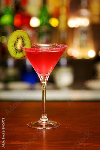 Red cocktail with kiwi