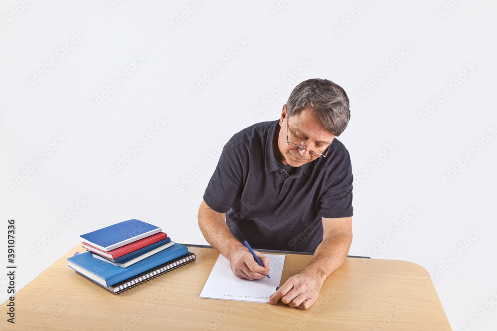 casual business man sitting at a table casual business man sitting at a table