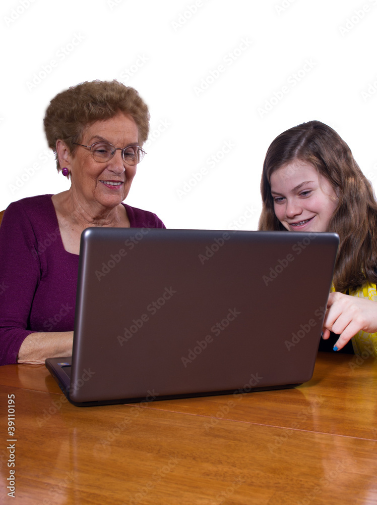 granddaughter and grandmother at a laptop granddaughter and grandmother at a laptop
