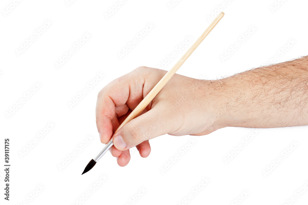 Hand using paint brush Hand using paint brush