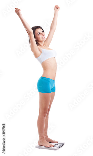 Woman squatting on a weighing machine