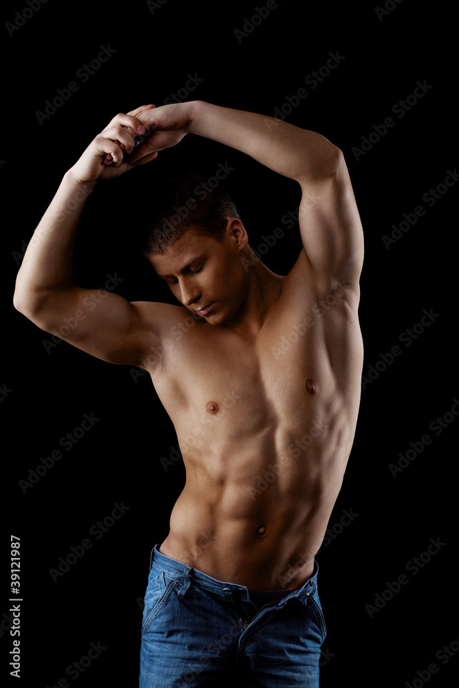 beauty athletic male posing nude in dark
