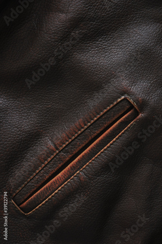 pocket of dark brown coat