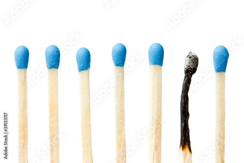 burnt match and a whole blue matches