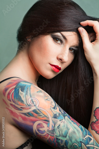 girl with stylish make-up and tattooed arm