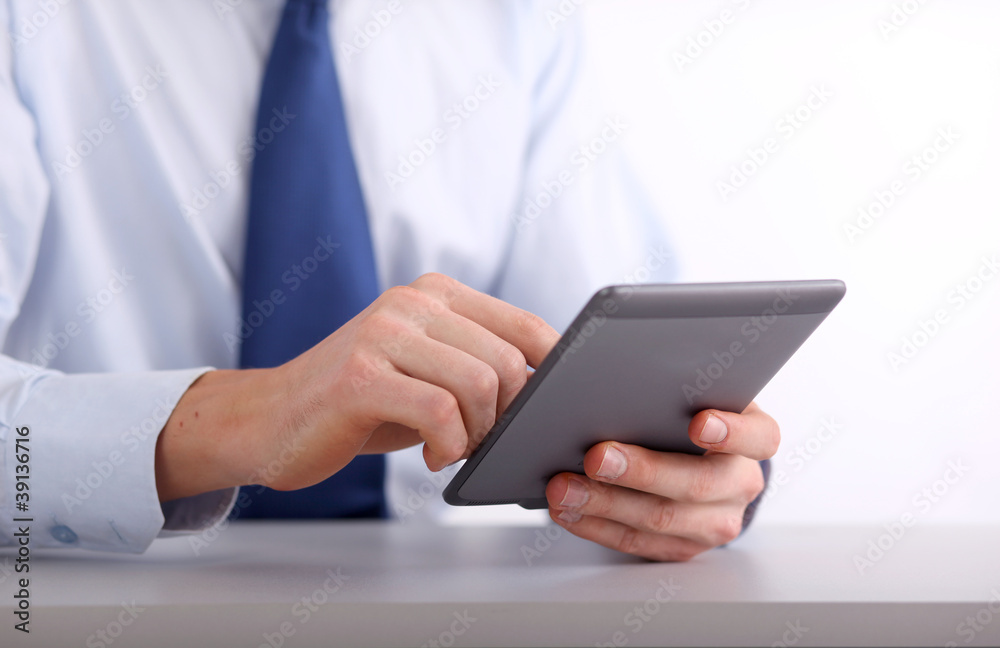 Young adult working on a digital tablet