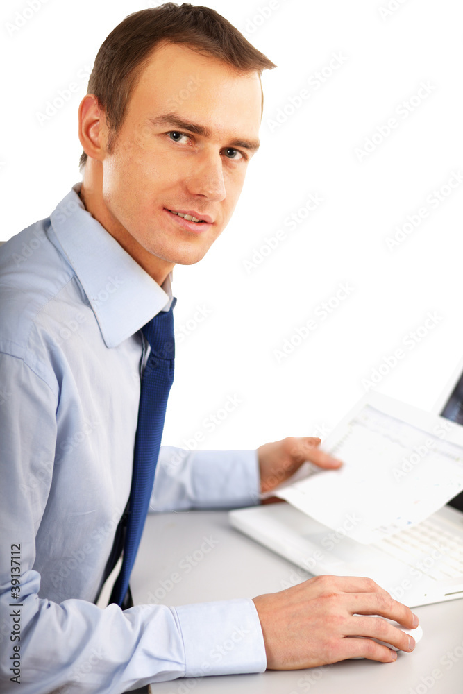 The businessman sitting on the desk in office The businessman sitting on the desk in office