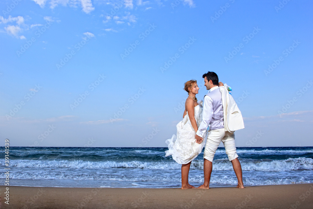 Couple at their beach wedding