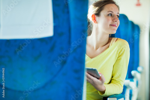 Young woman using her tablet computer © lightpoet
