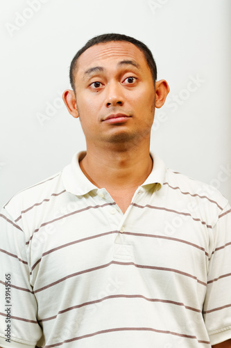 asian young man with questioning face expression