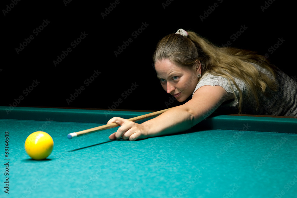 Fototapeta premium woman plays russian billiards
