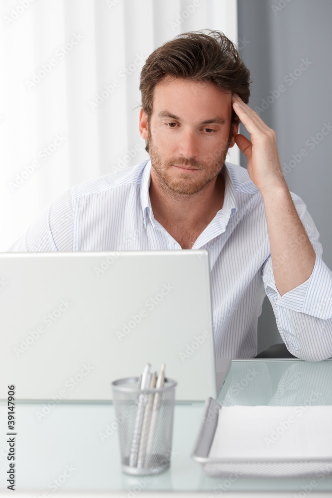 Businessman concentrating on computer work Businessman concentrating on computer work