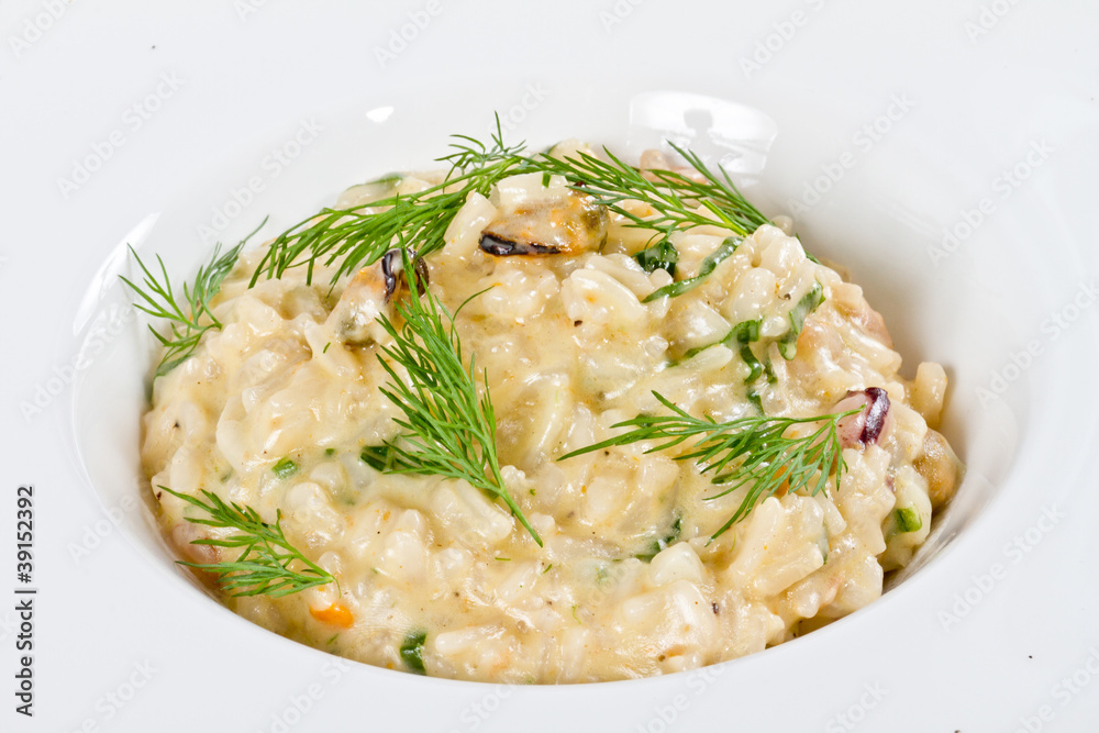 photo of delicious risotto with seafood and dill on it photo of delicious risotto with seafood and dill on it