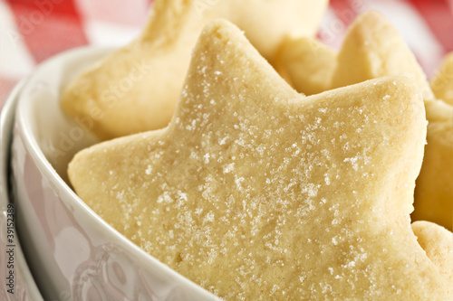 Sugar coated shortbread cookies in star shapes stacked up