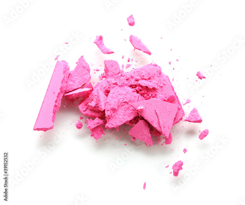 Crushed pink eyeshadows isolated on white