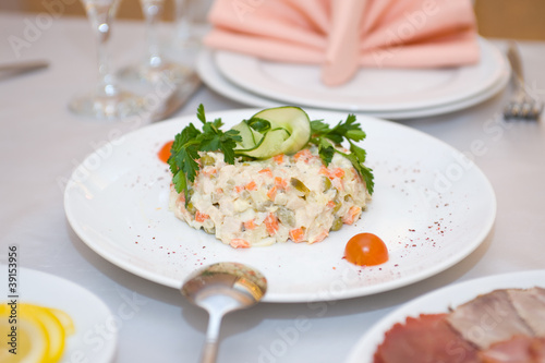 Russian salad on white plate