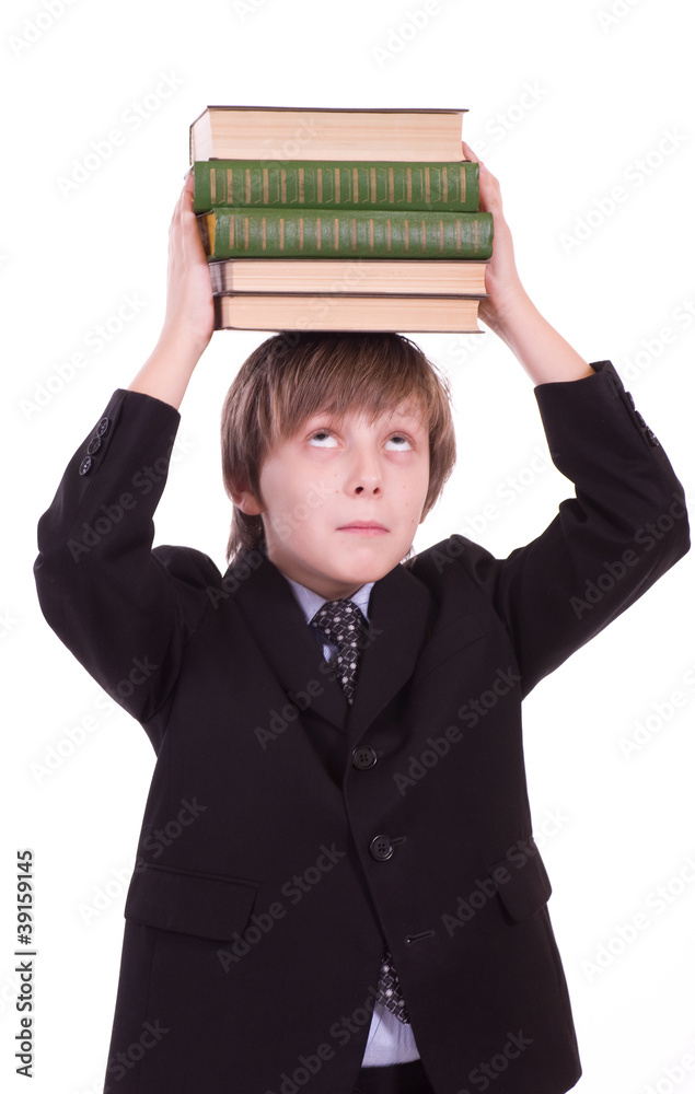 Little schoolboy with books isolated on a white background Little schoolboy with books isolated on a white background