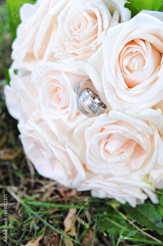 wedding bouquet and golden rings