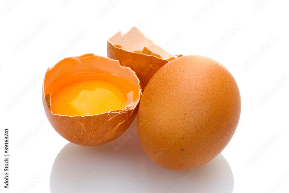 Brown eggs with yolk isolated on white Brown eggs with yolk isolated on white