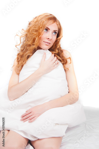 Redheaded woman holding pillow © Angel_a