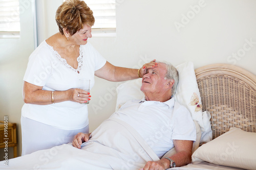 loving senior wife comforting ill husband © michaeljung