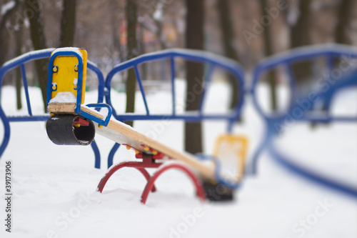 Seesaw playground in snow photo