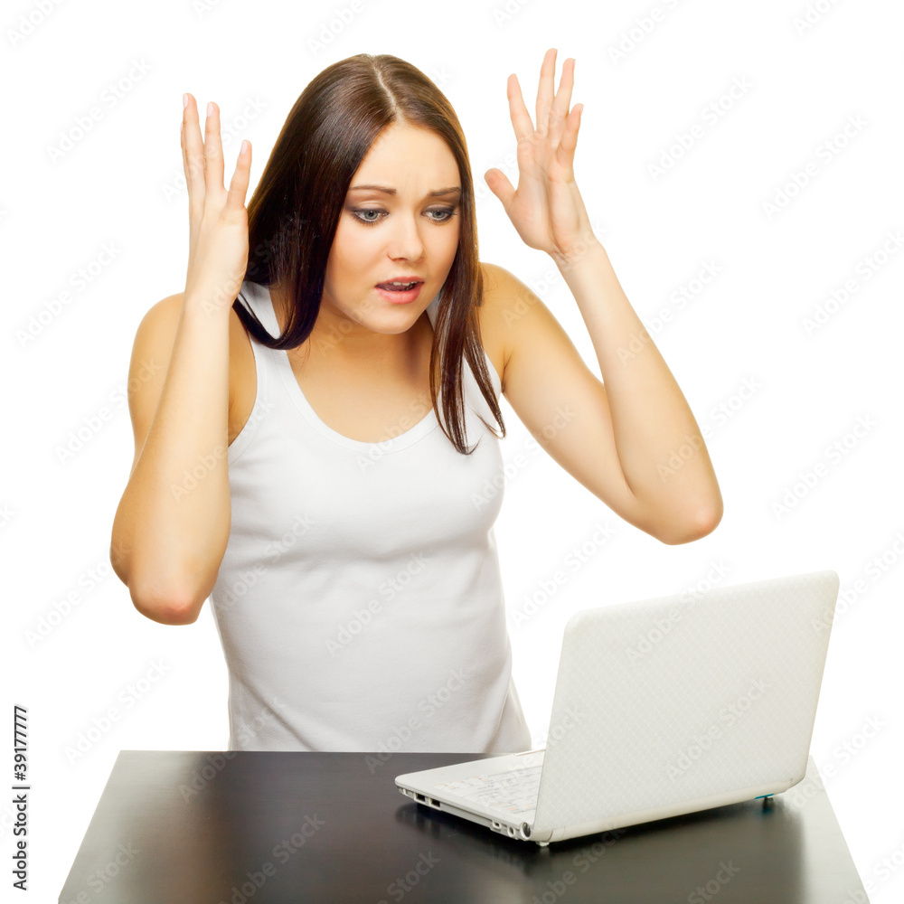 The young woman with the laptop behind a table