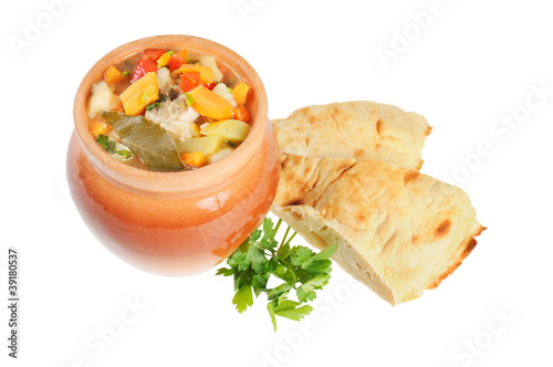 Roast in a pot and pita bread photo