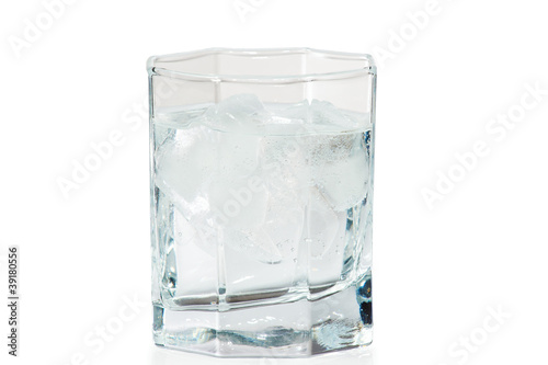 Glass of water and ice on a white background