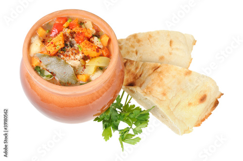 Roast in a pot and pita bread photo