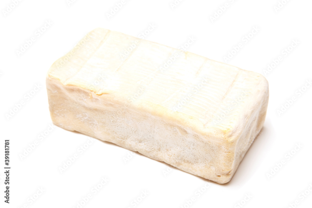 French Demi Pont L'Eveque cheese isolated on a white studio back French Demi Pont L'Eveque cheese isolated on a white studio back