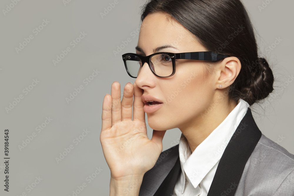 Side view of business woman calling out to someone Side view of business woman calling out to someone