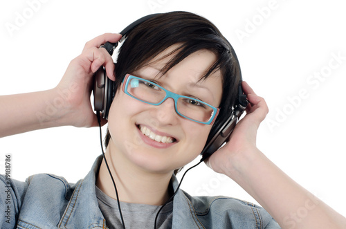 Girl listens to music through ear-phones