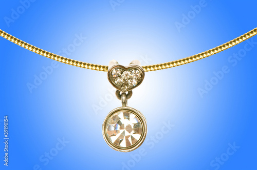 Golden jewellery against gradient background