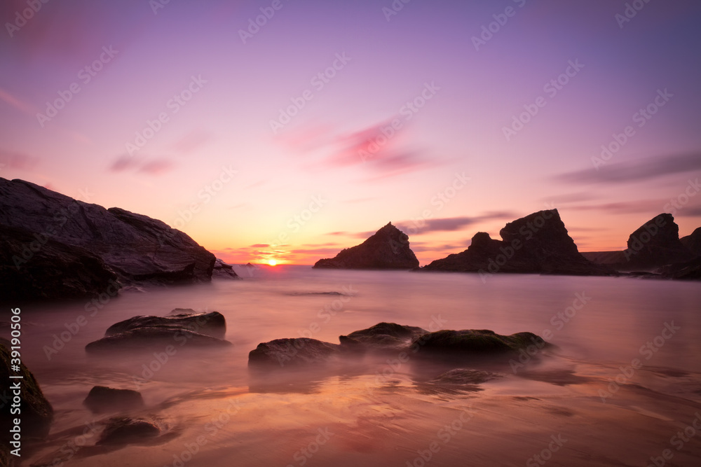 Bedruthan Steps at sunset with violet skies, Cornwall, England