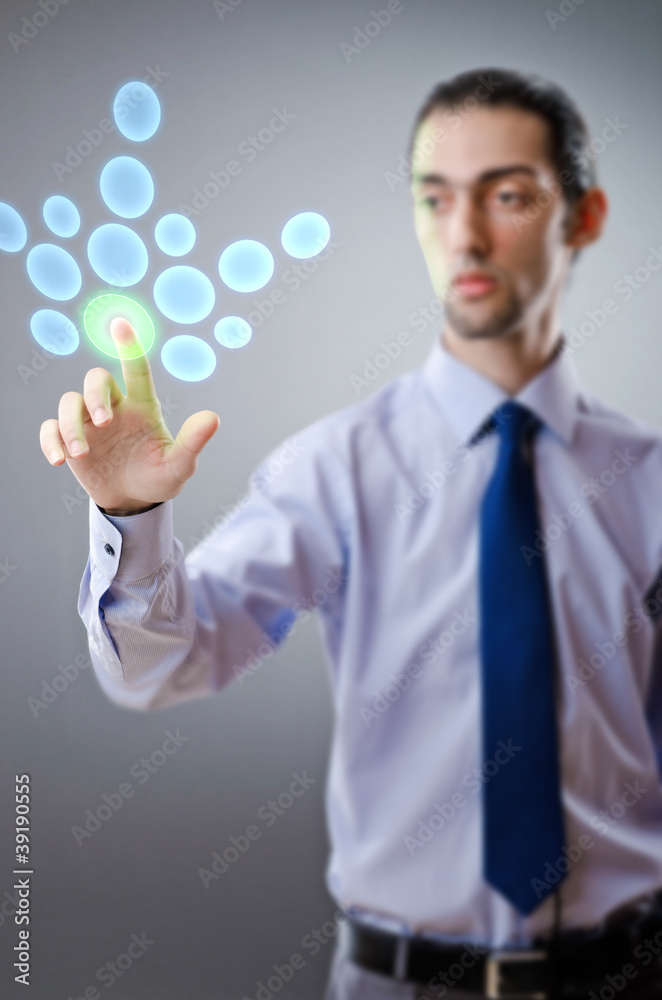 Businessman pressing virtual buttons Businessman pressing virtual buttons