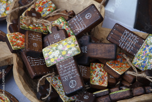 wooden painted crossess in a basket photo