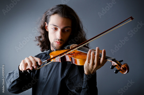 Violin player playing the intstrument photo