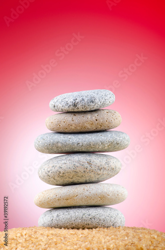 Balanced pebbles with colour background