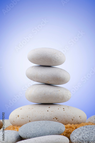 Balanced pebbles with colour background