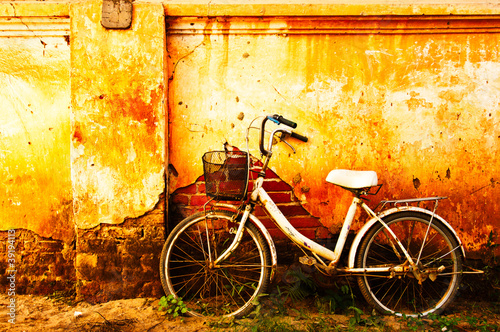 Old bicycle and brick wall