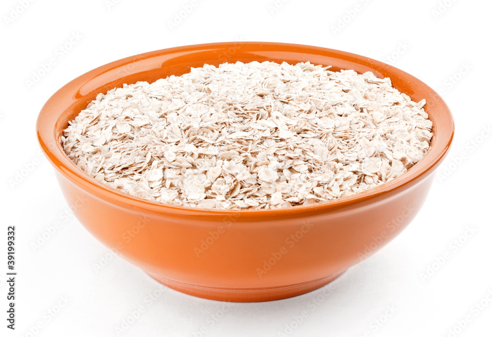 Oat-flakes in bowl on white background Oat-flakes in bowl on white background
