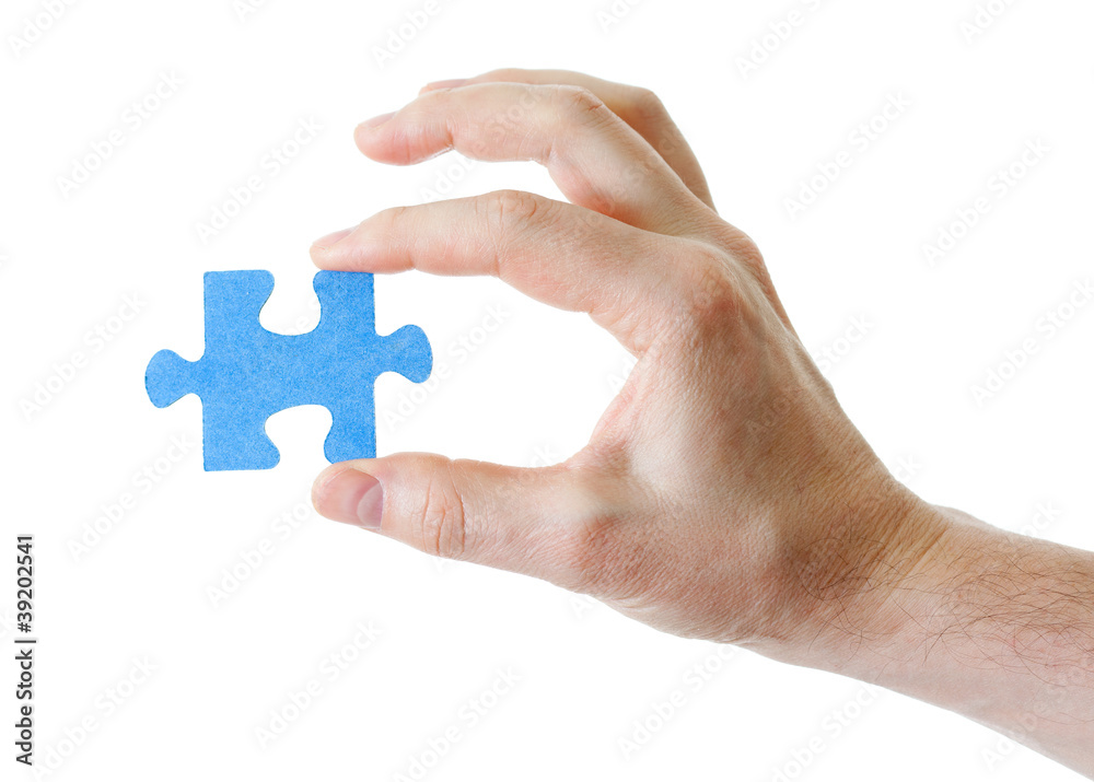 puzzle in hand on white background puzzle in hand on white background