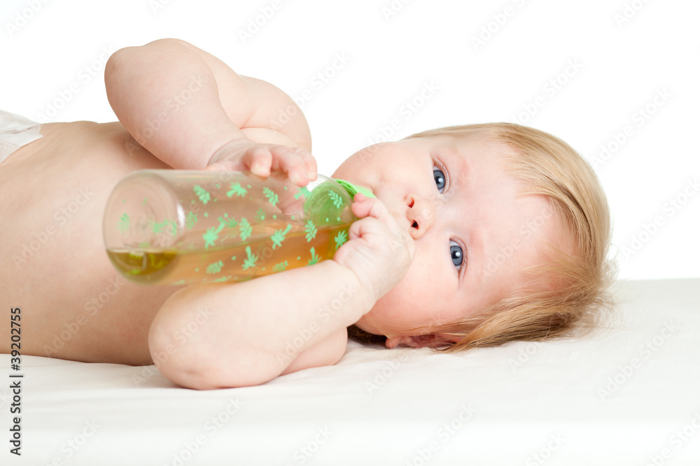 adorable child drinking from bottle. 6 months old girl. adorable child drinking from bottle. 6 months old girl.