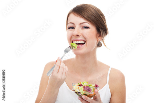 Woman eating salad isolated