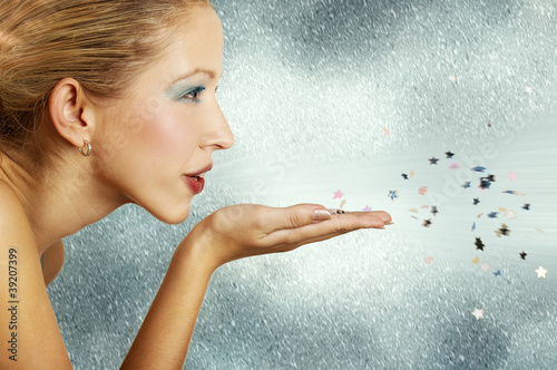 Photos Young woman blowing little stars